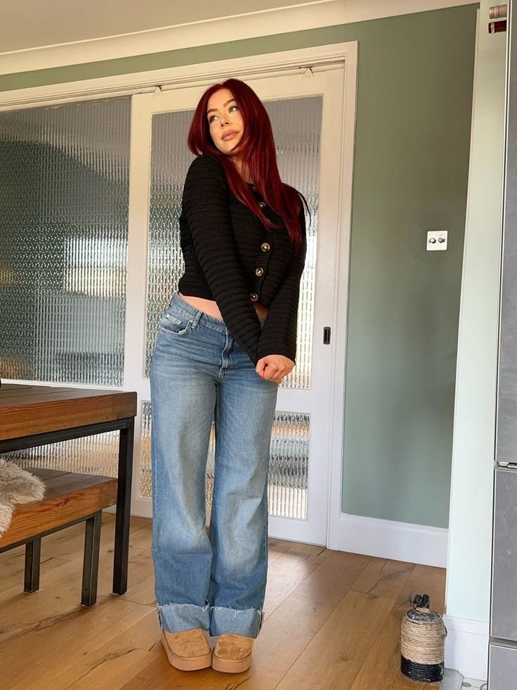 Black cardigan with wide-leg blue jeans