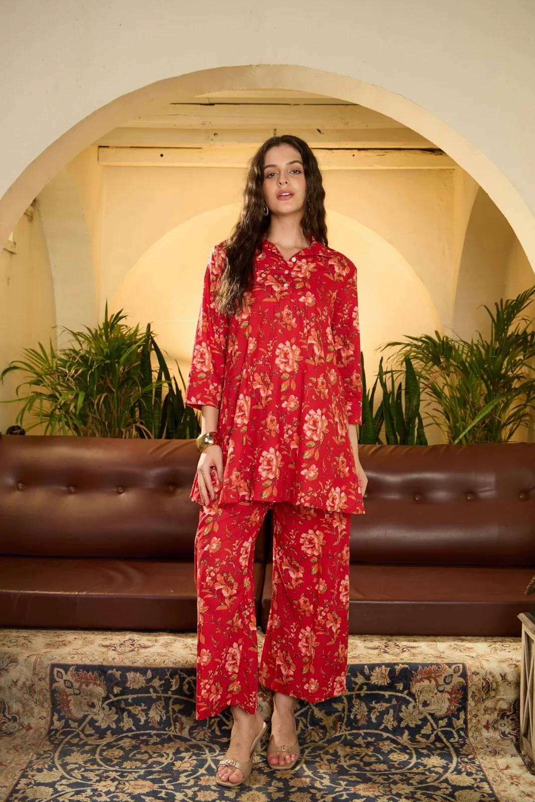 Red floral matching tunic and cropped trouser outfit indoors